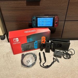 NINTENDO SWITCH CONSOLE WITH ALL ORIGINAL ACCESSORIES AND BOX.